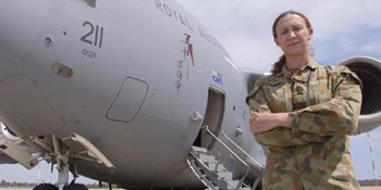 DEFGLIS Social Affirmation An Air Force member of DEFGLIS wearing DPCU standing in front of a C130J Hercules
